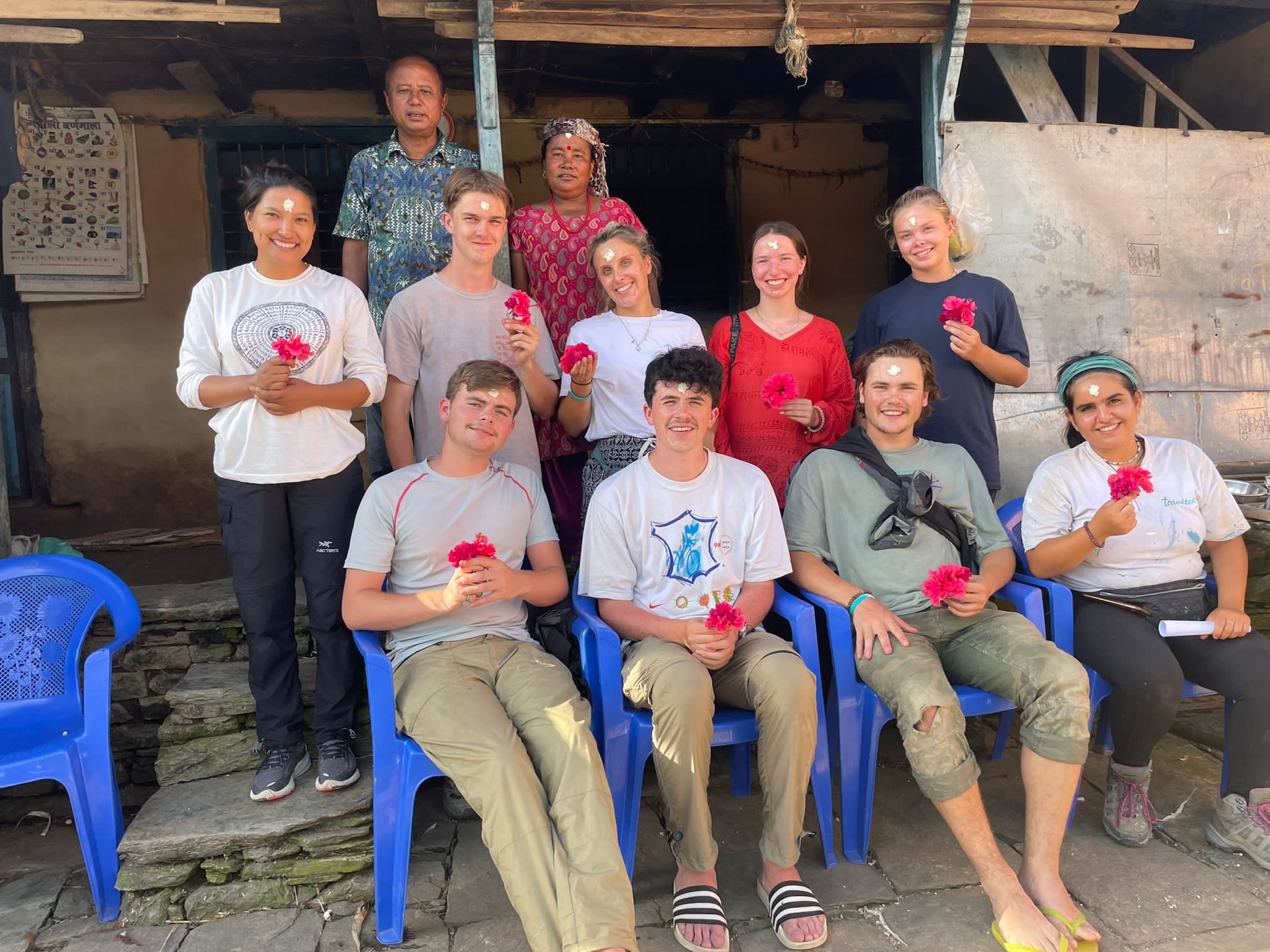 Inside classroom at Jyoti School, students and volunteers working together at desks